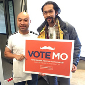 Before growing a moustache, AM1430 DJ Edwin Lok (left) posed with Movember's Sam Ho for a photo.